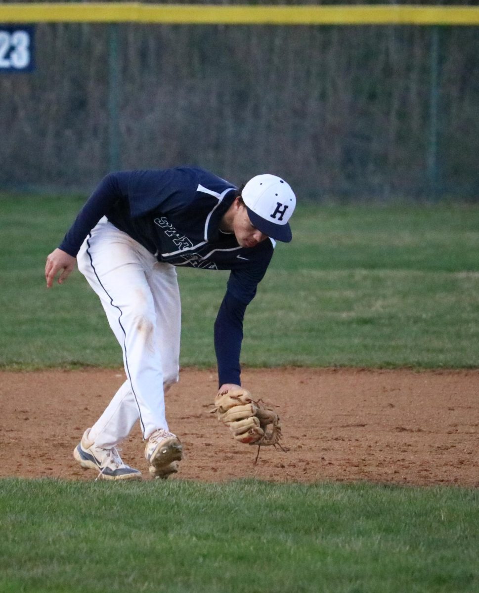Sophomore Xavier Banks picks up a ground ball.