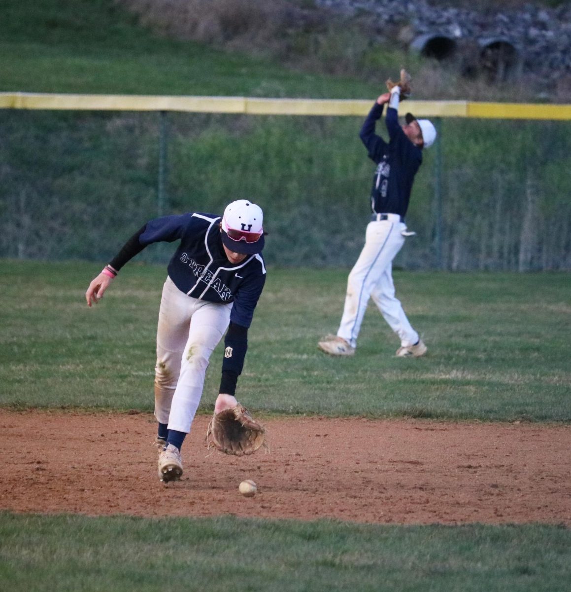 Freshman Shelby Spears runs to pick up the ground ball. 