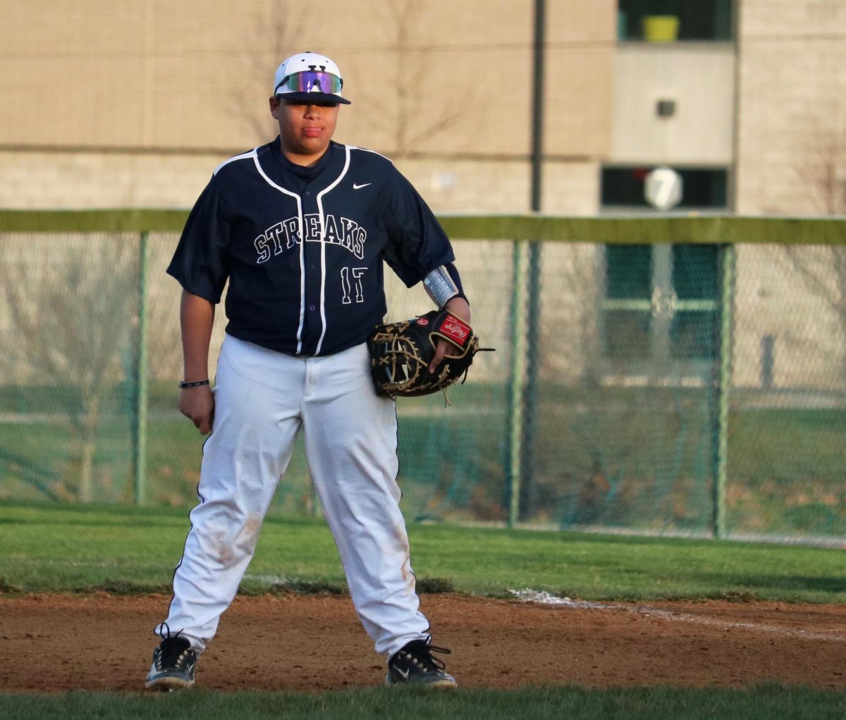 Freshman Jason Guzman-Beltre watches the batter as he gets ready for the play to happen. 