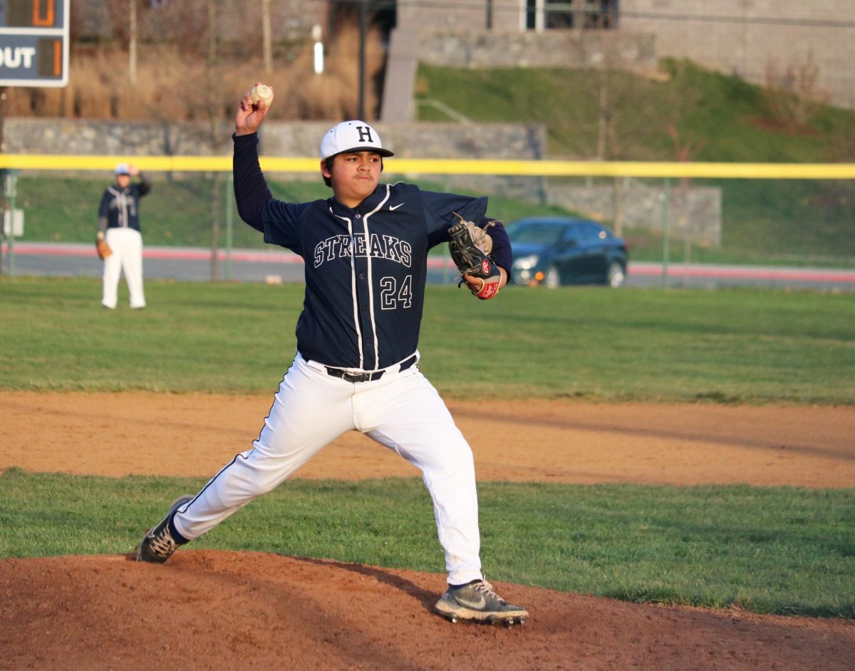 Freshman Xavier Ruvalcaba pitches the ball. 