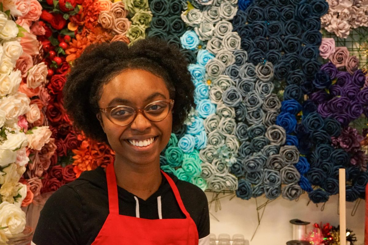 Sweet Joy's Cakes and Desserts owner Naomi Joy Brazeil stands in front of her display of artificial flowers that she uses for cake decorations. "I like having them up here, so we can see what we need. My aunt just came up here and helped me get something organized," Naomi Joy Brazeil said. 