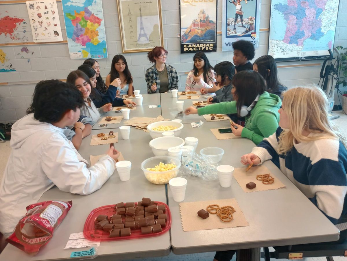 The French club hosts a meeting to brainstorm fundraising ideas. 