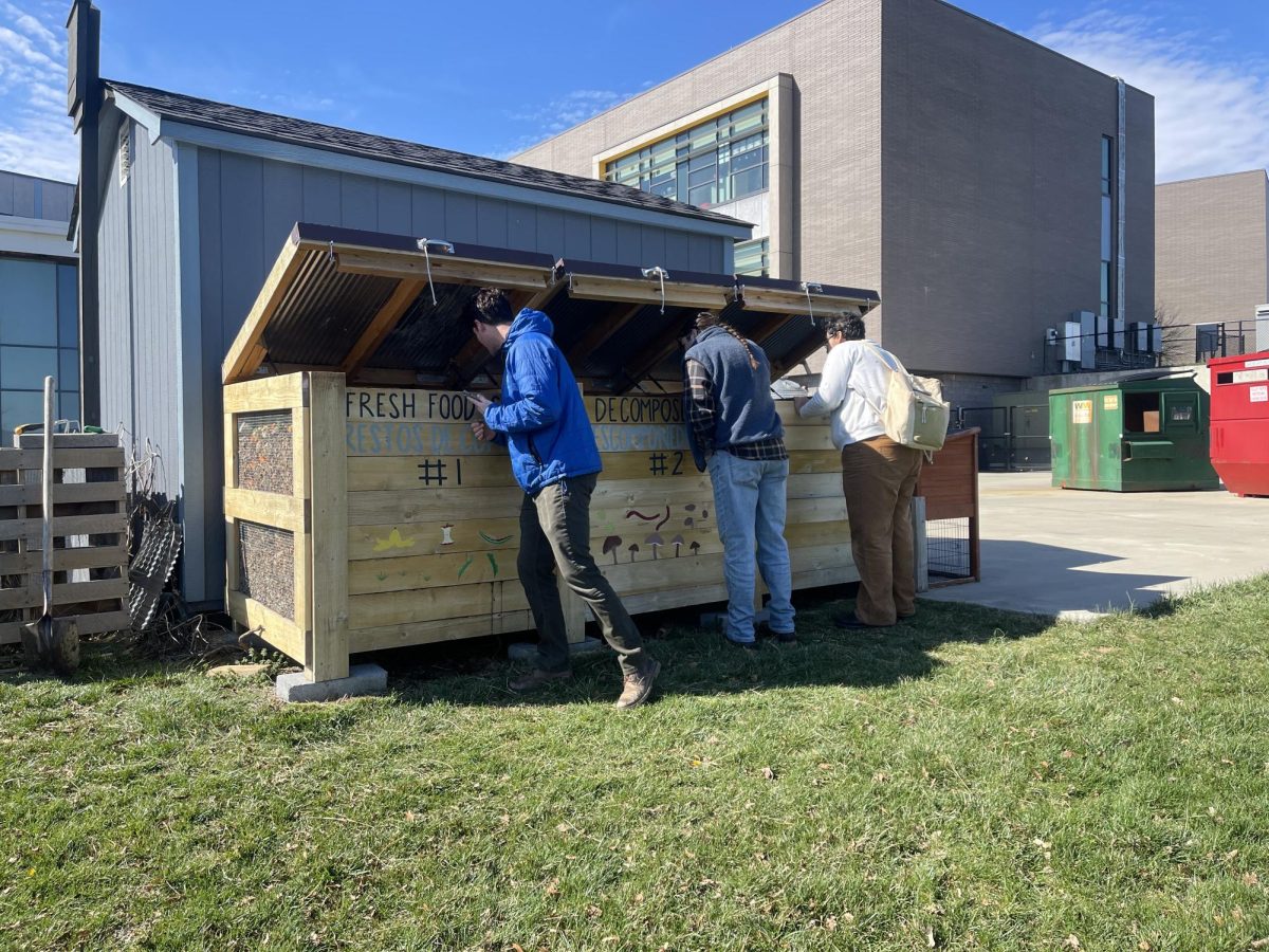 Members looking inside of the boxes.