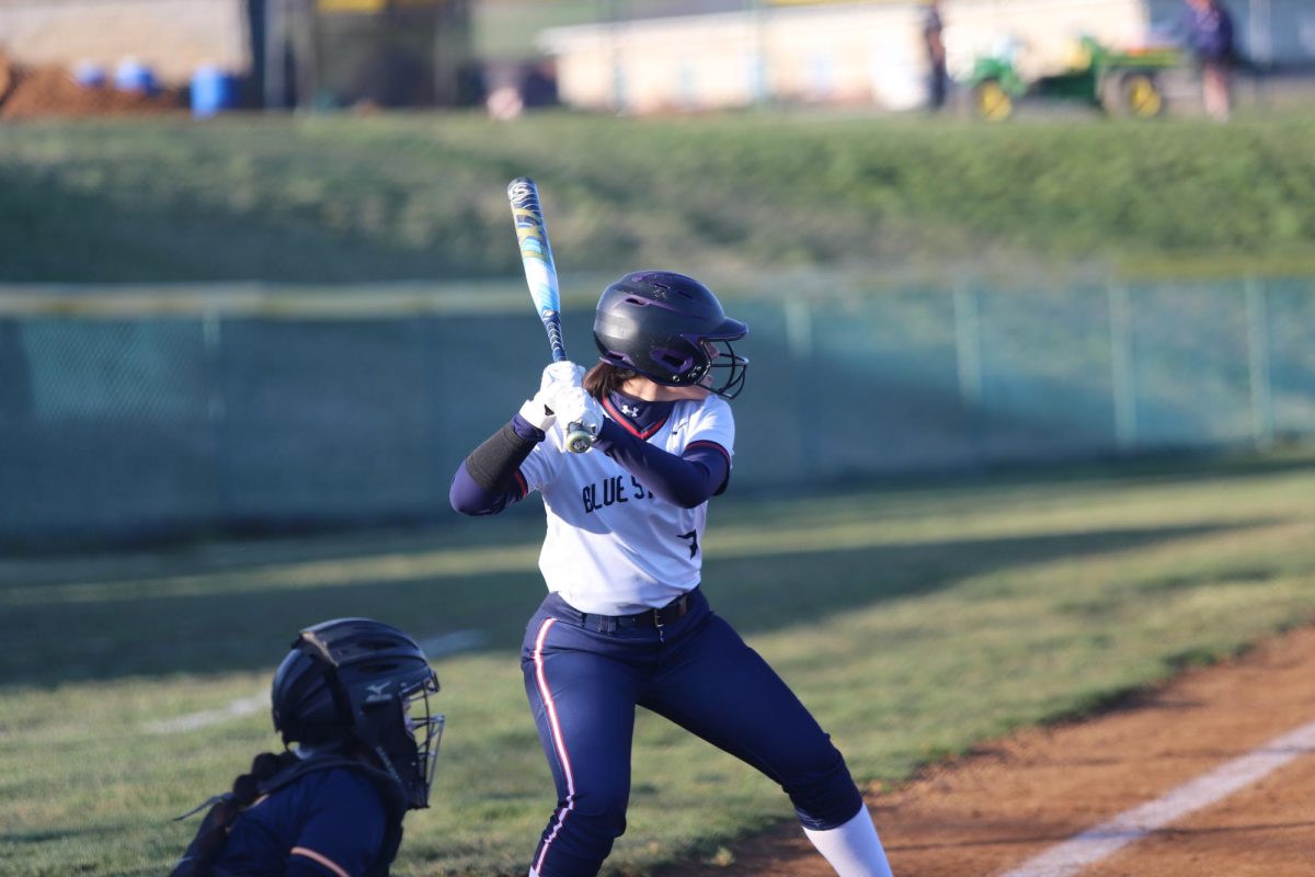 Freshman Isamar Cruz Chavez prepares to swing while waiting for the pitcher.