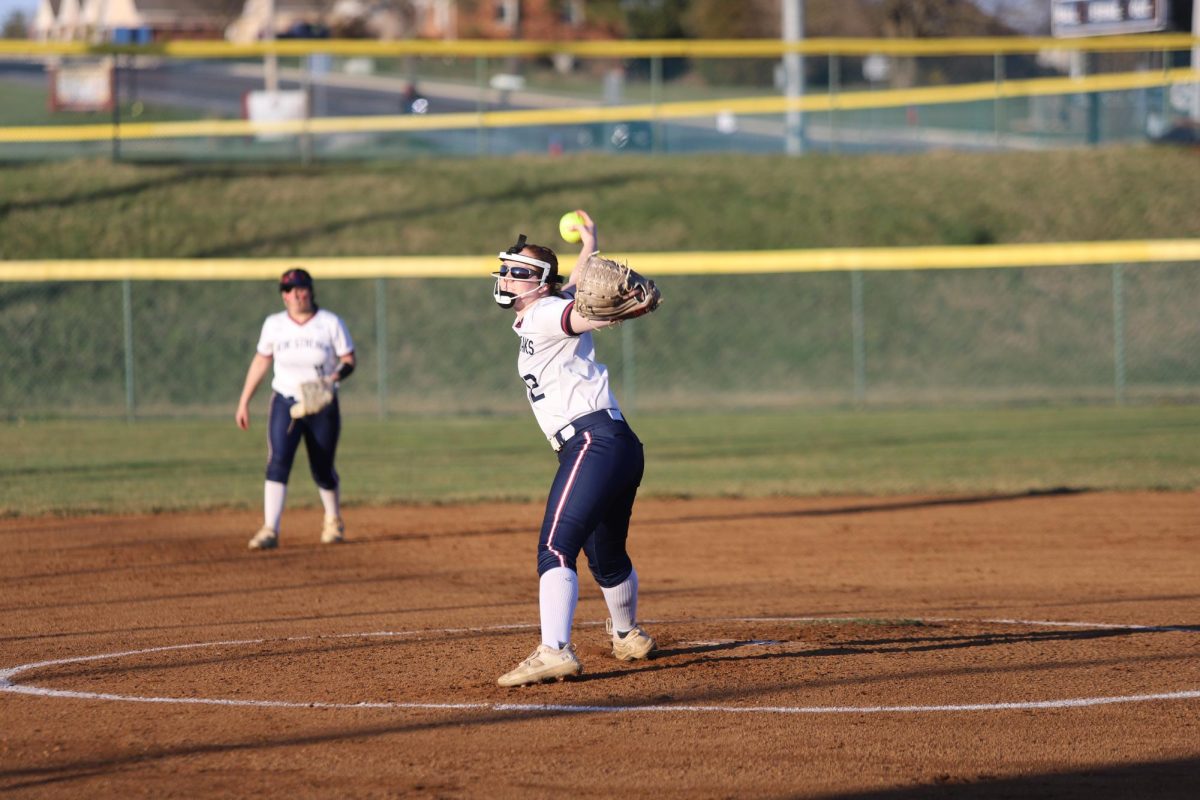 Senior Ashlyn Smiley pitches to the batter. 