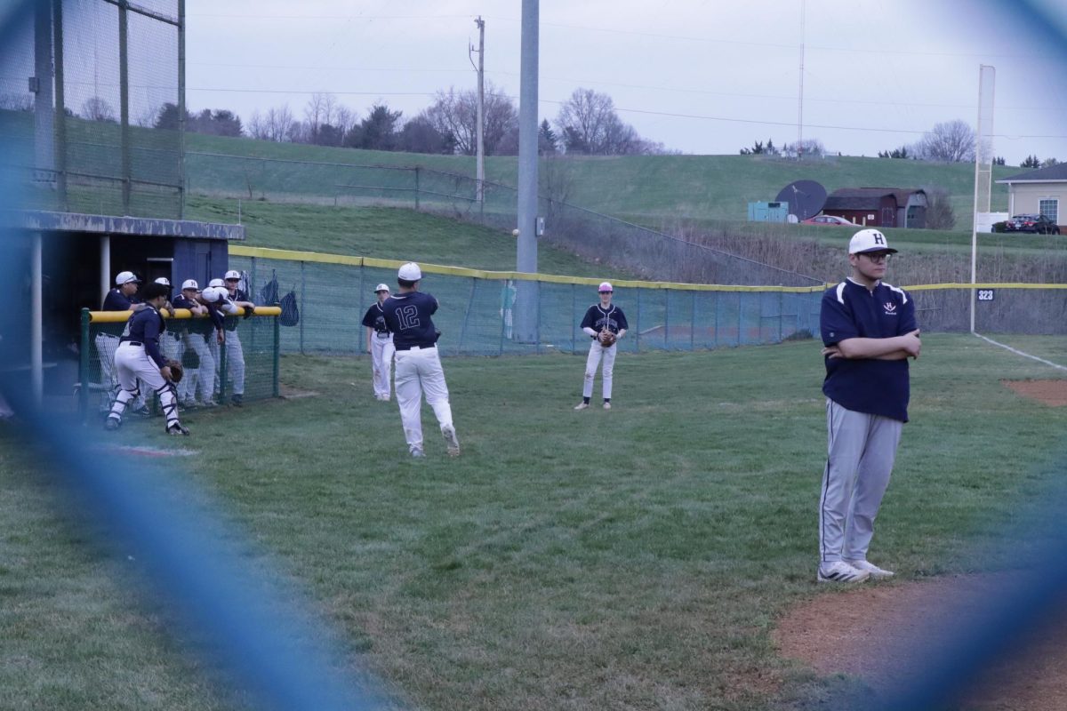 HHS JV players observing what their team members are doing during the warm-up.