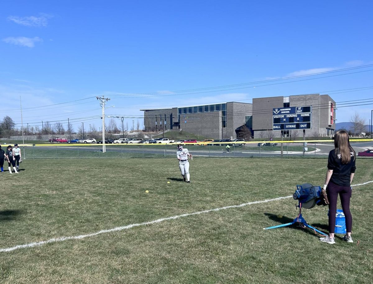 Sophomore LaMya Coleman-Will hussles to get a missed ball in the outfield.
