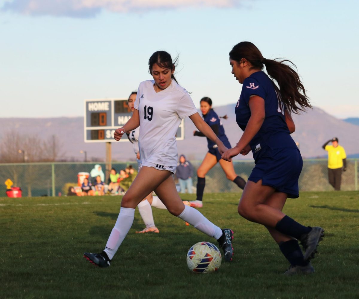 Sophomore Carmen Flores dribbles past a defender.