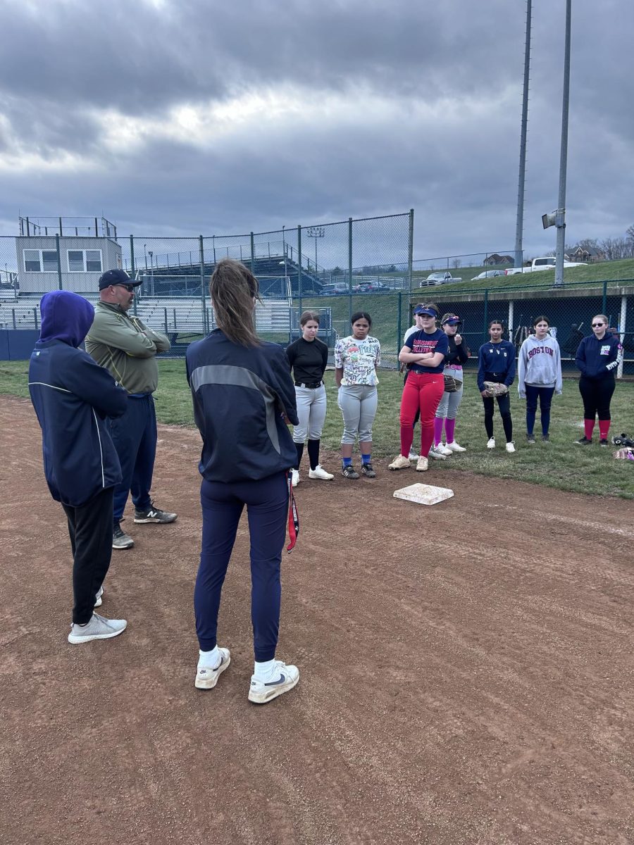 JV players listen for directions on their next activity.