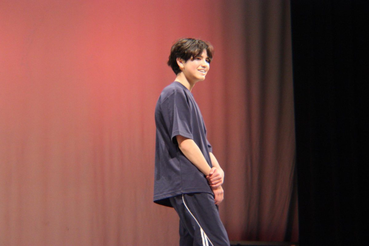 Junior Theo Thompson smiles after his solo performance.