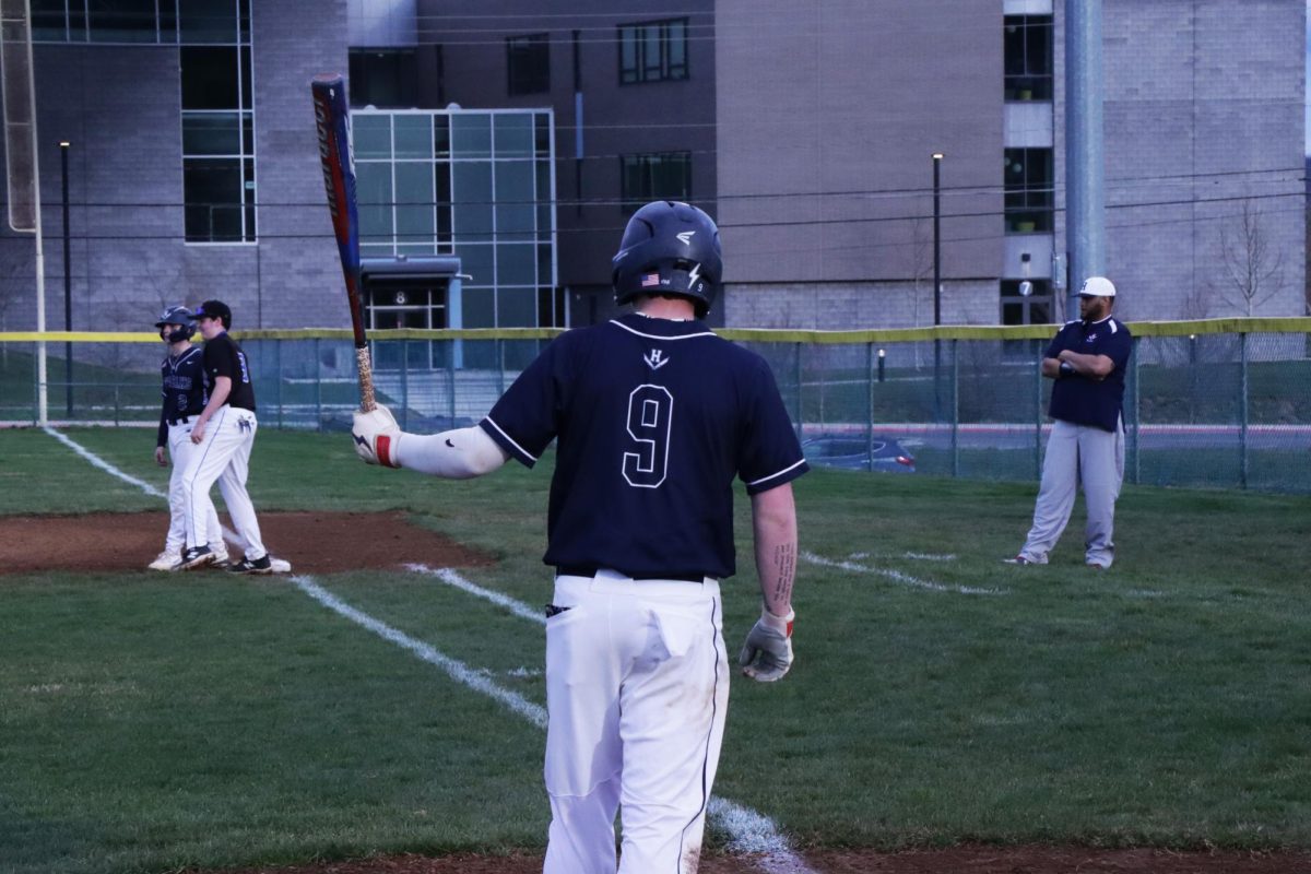 Senior Nolan Henry gets ready to swing.