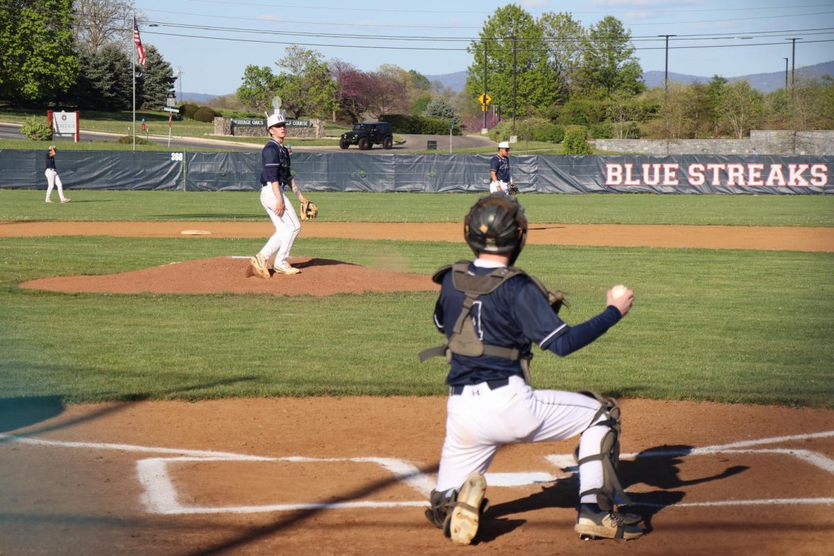 Varsity player Cayden Lucas throwing the ball.