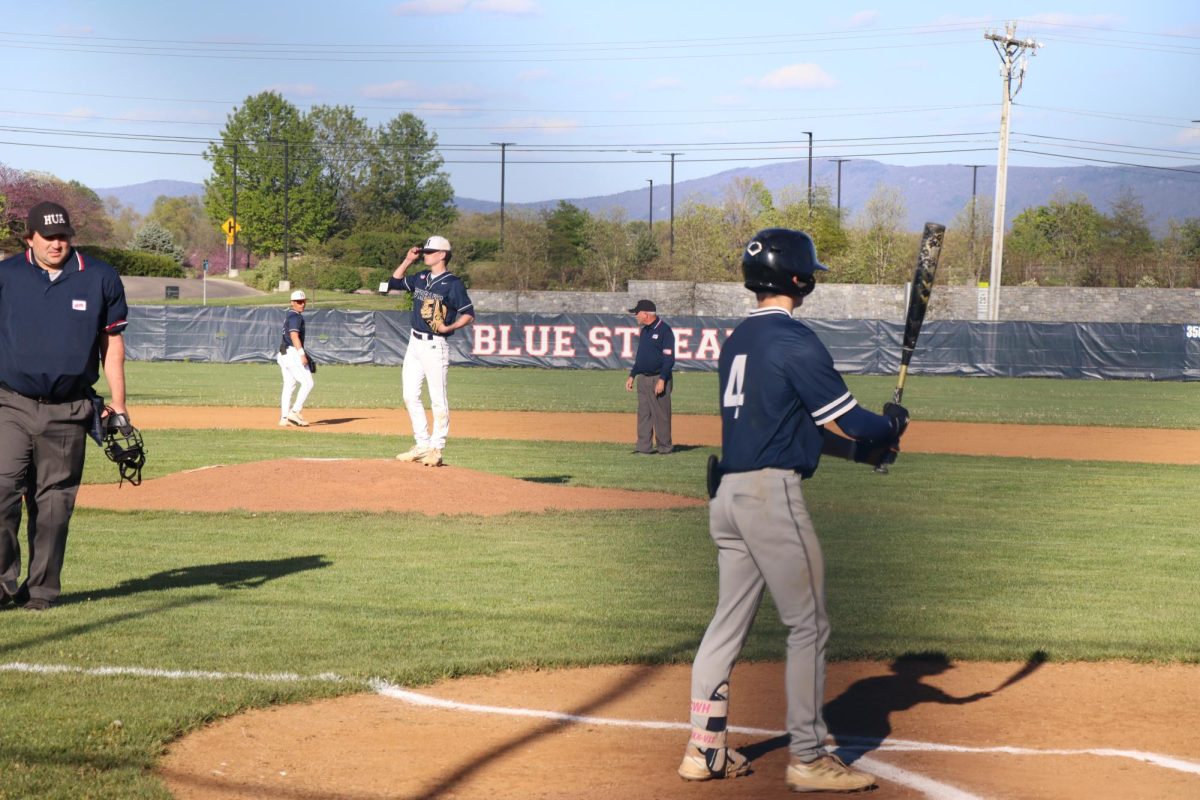 Varsity player Cayden Lucas getting ready to pitch.