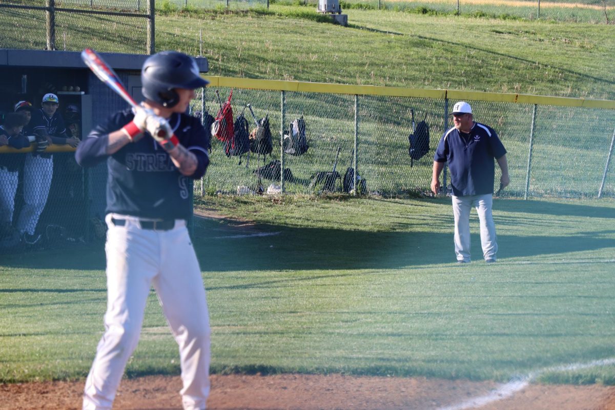 Coach keeping an eye on players