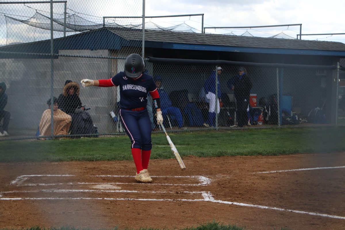 Senior Idaly Alvarez  clears the batting box before hitting in the first inning during the Spotswood away game. 