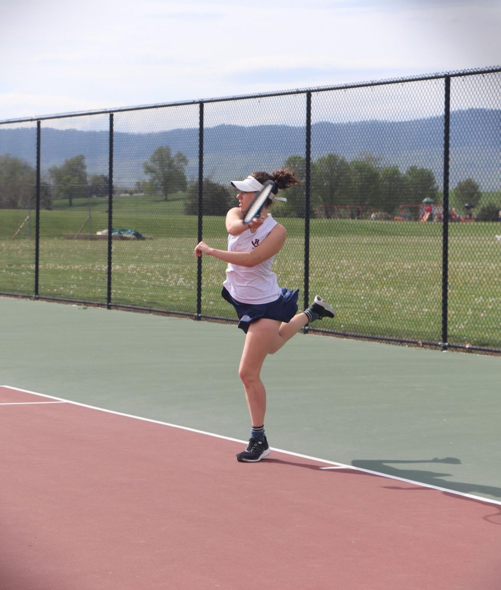 Senior Caryanne Shaw volleys back during her first game at ERHS. 4-19