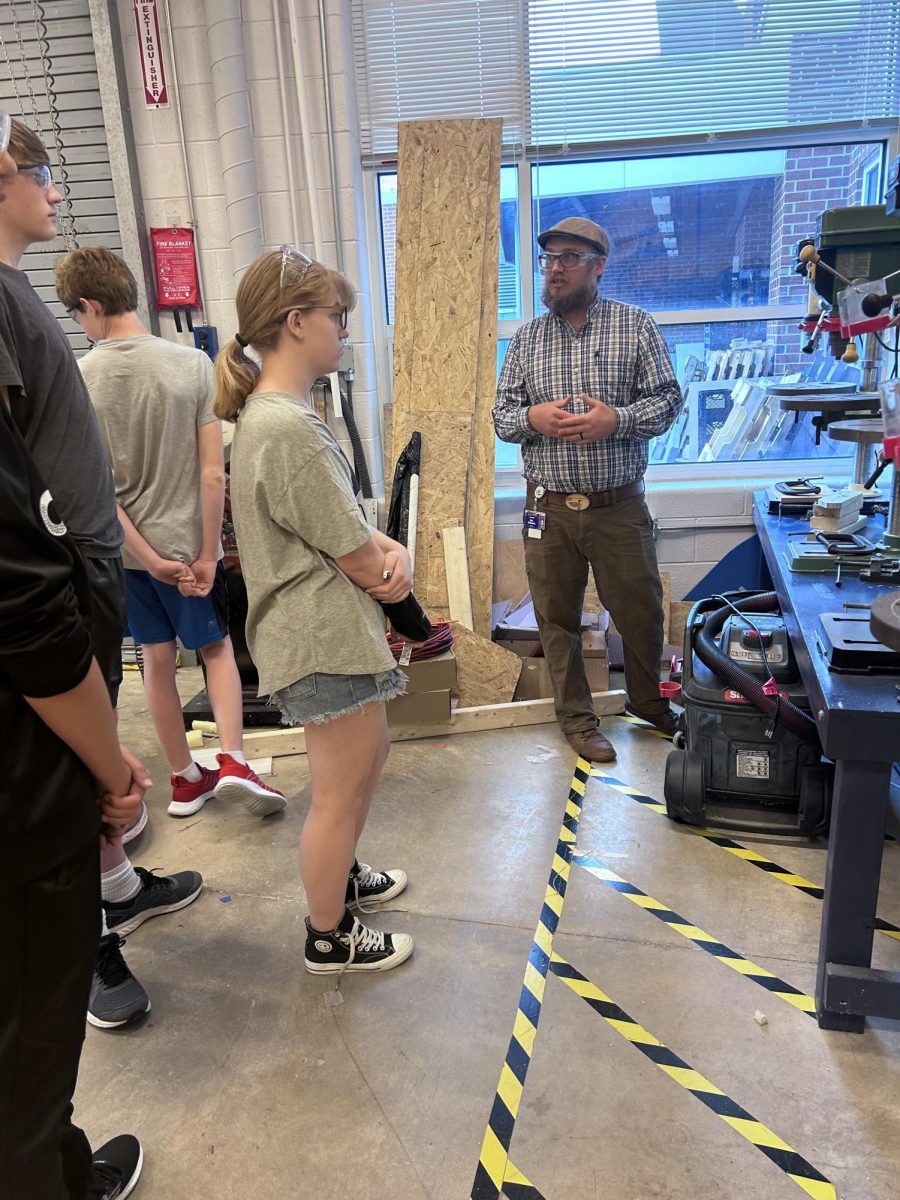 Mr. Shantz explains to students how to use the machinery.