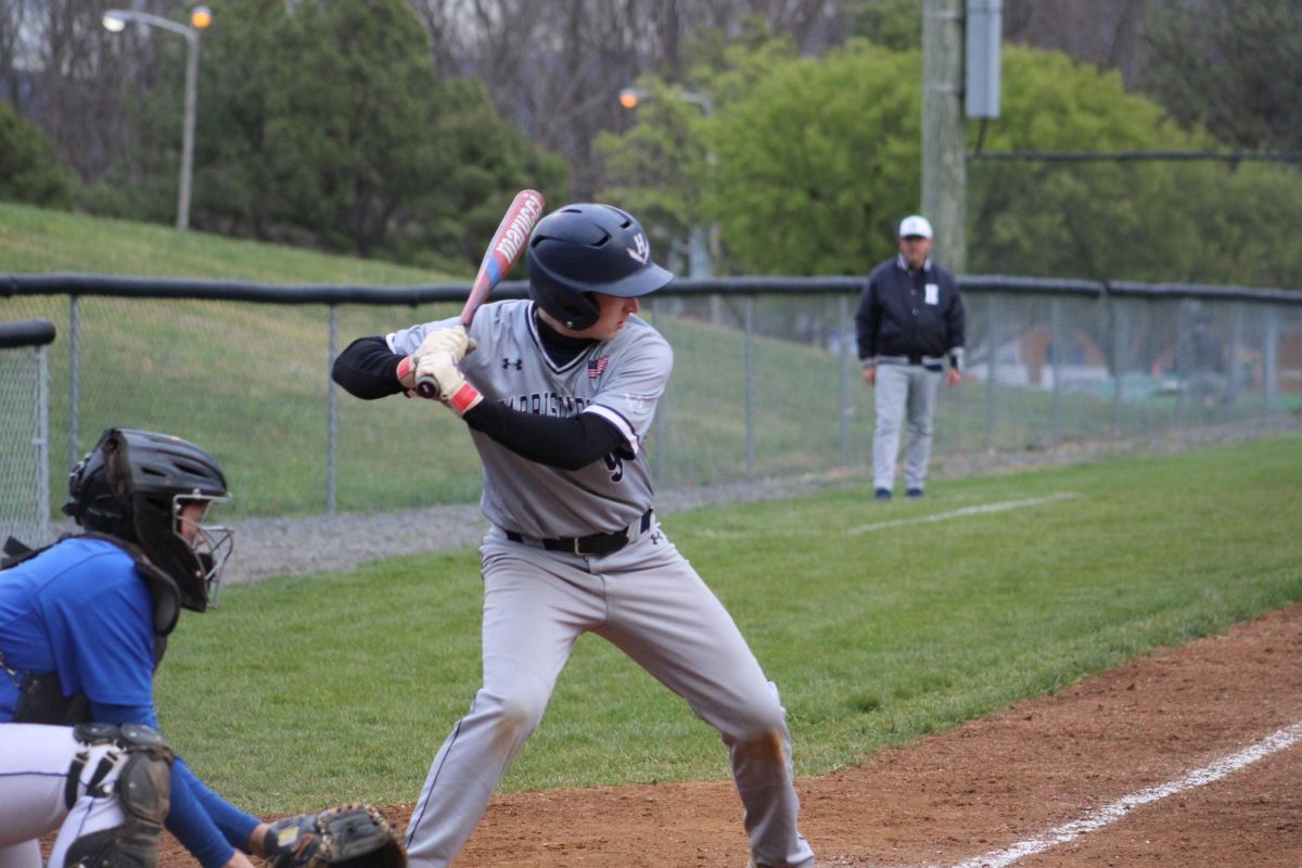 Senior Nolan Henry gets ready to hit the ball.