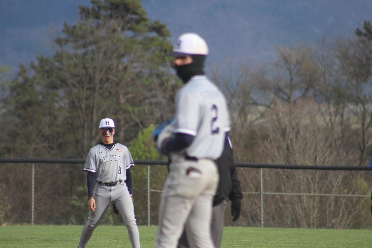 Sophomore Jayden Barnard and senior Sawyer Hook warm up before playing.