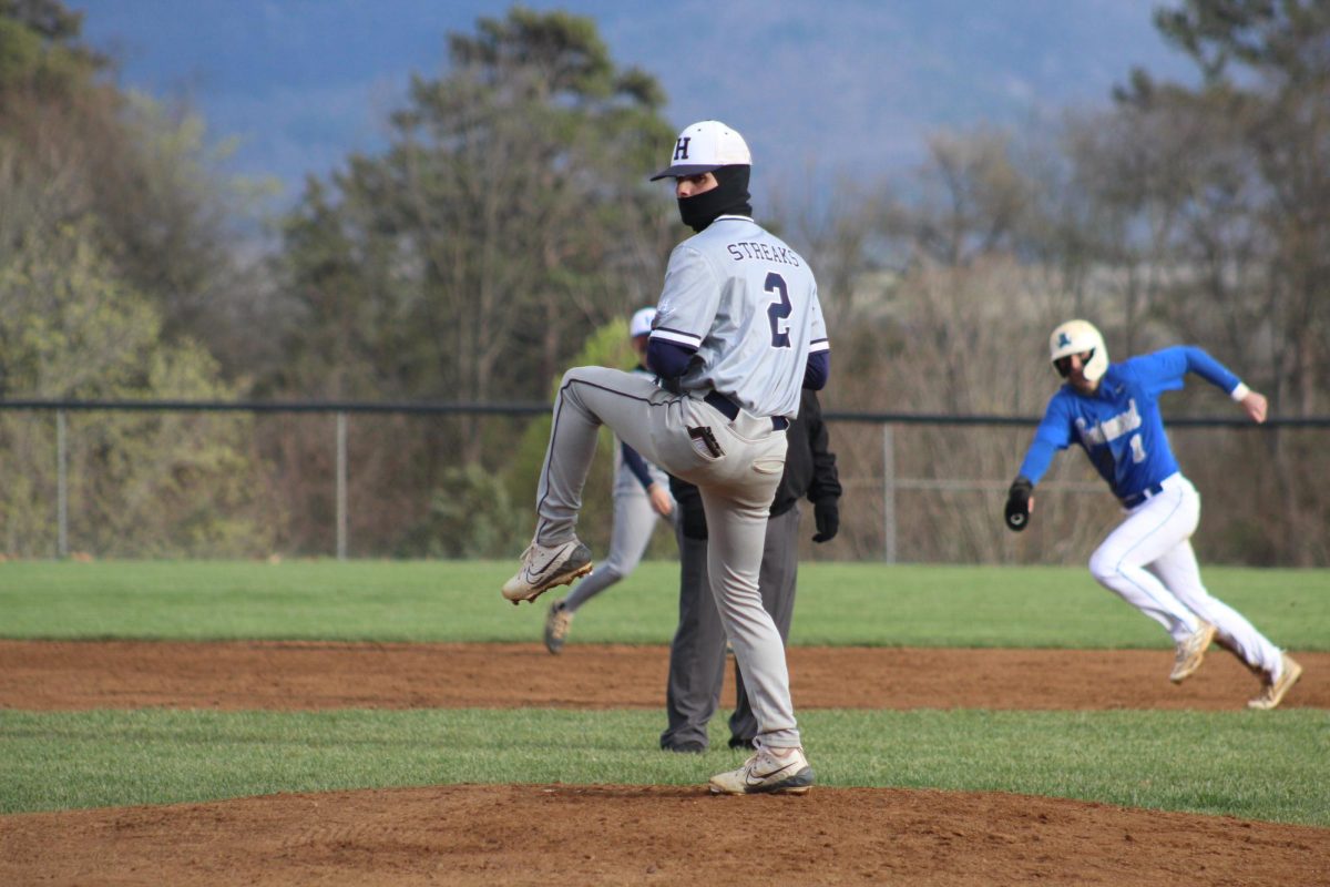 Senior Sawyer Hook prepares to pitch the ball.