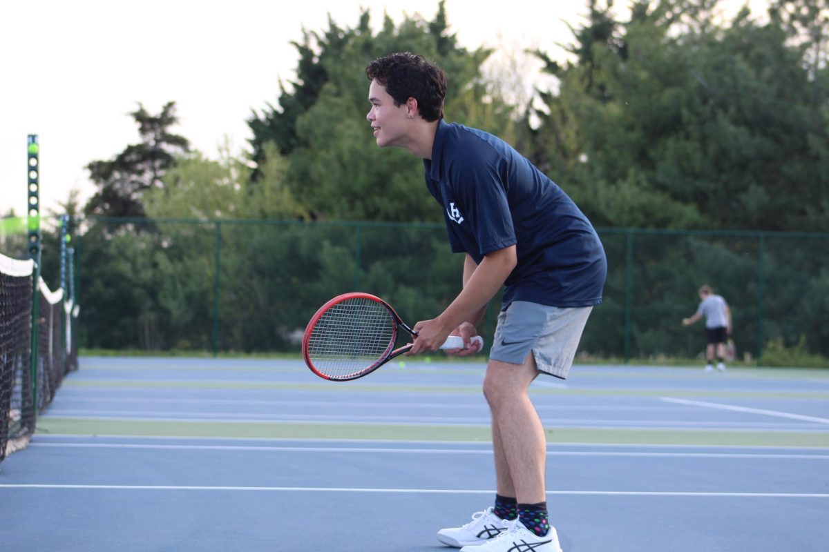 Sophomore Gbae Sabarre gets ready to volley at the net.