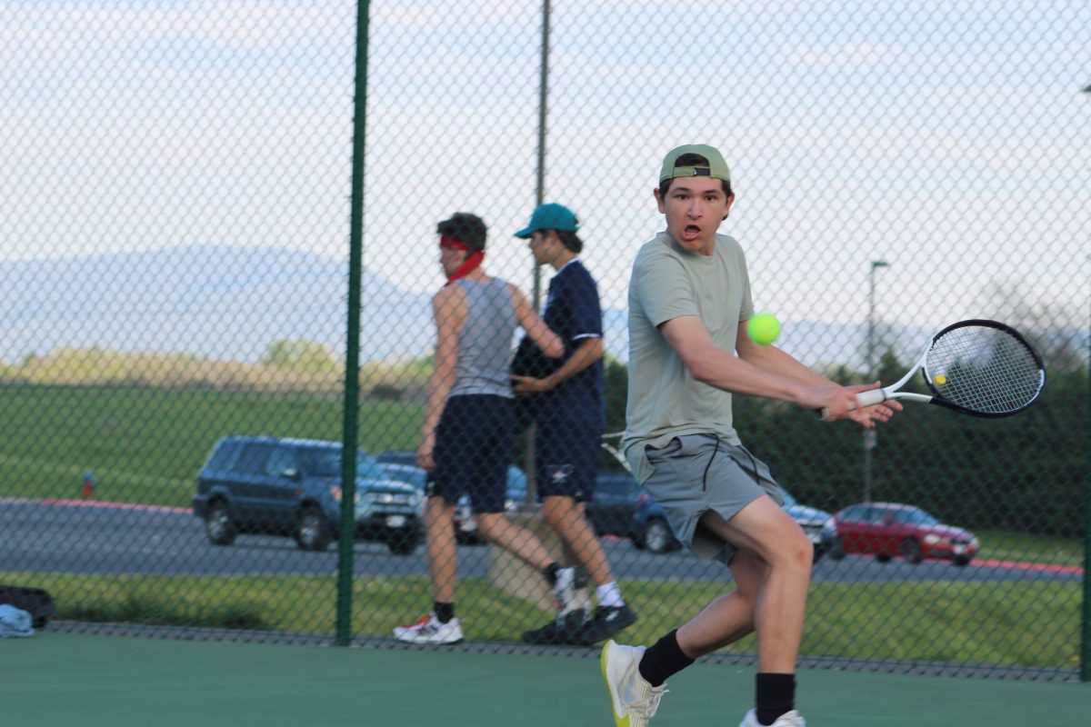 Freshman Brody Beshoar plays a singles match. 