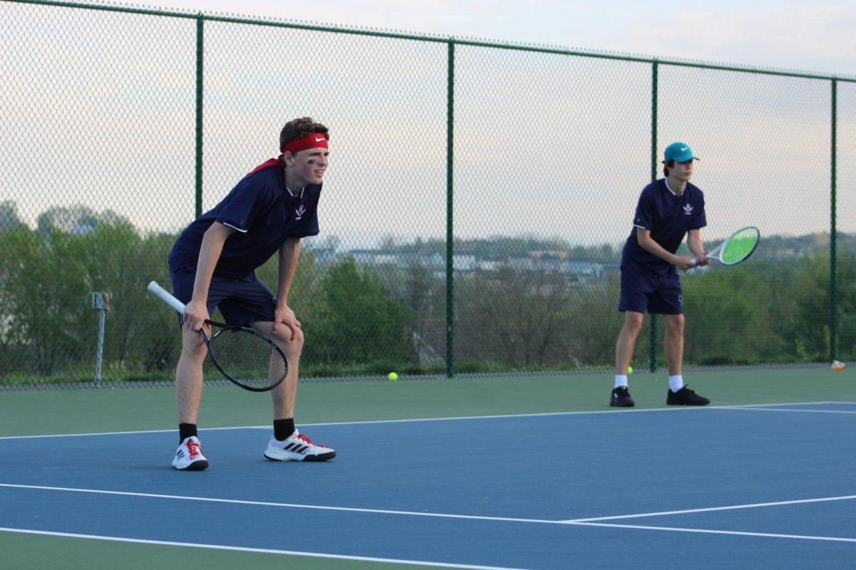 Junior Louis Gibson and freshman Lleyton Steins play a doubles match against East Rock.