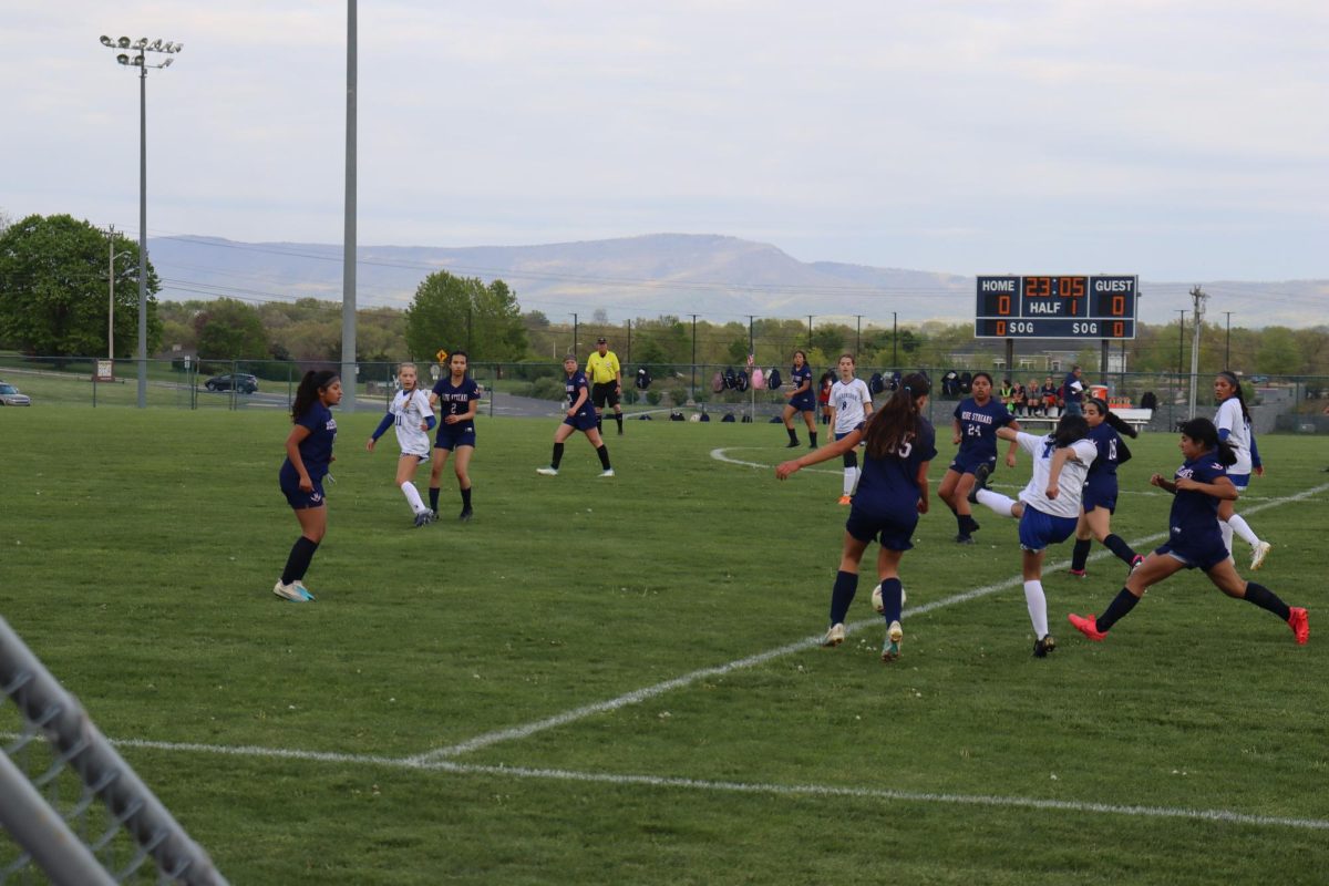 Blue Streak girls wait in their position for the ball. 