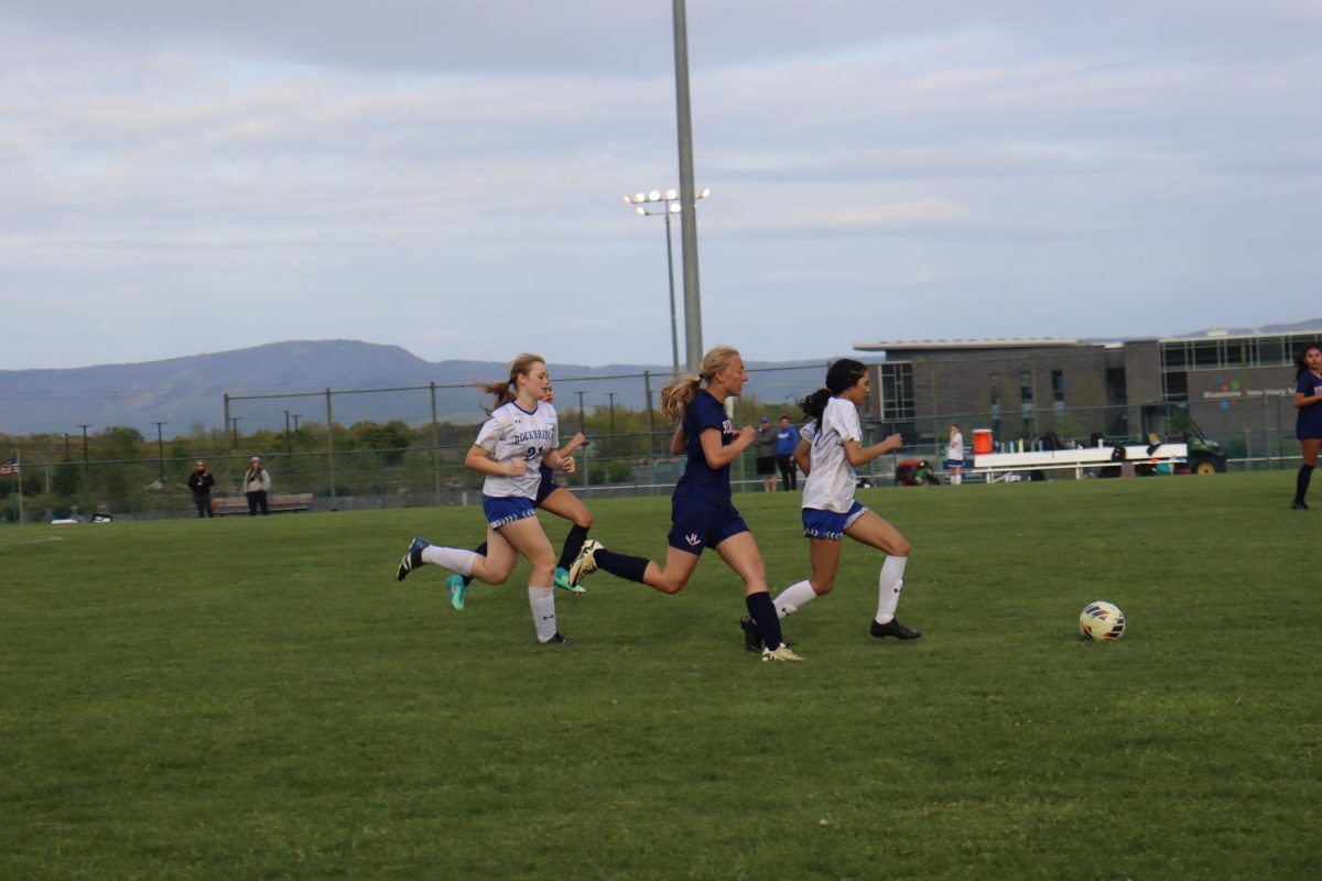  Freshman Katherine chases after the ball. 