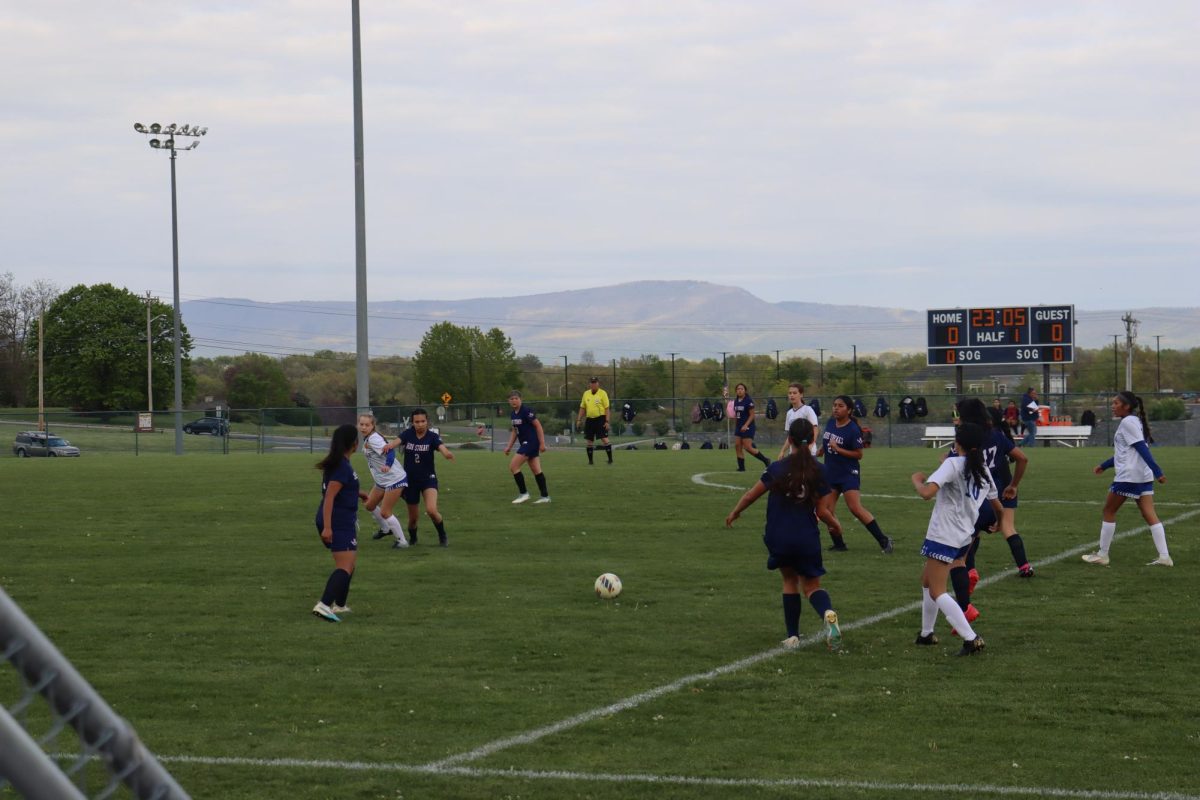 A group of Blue Streak wait for the right moment to kick the ball. 