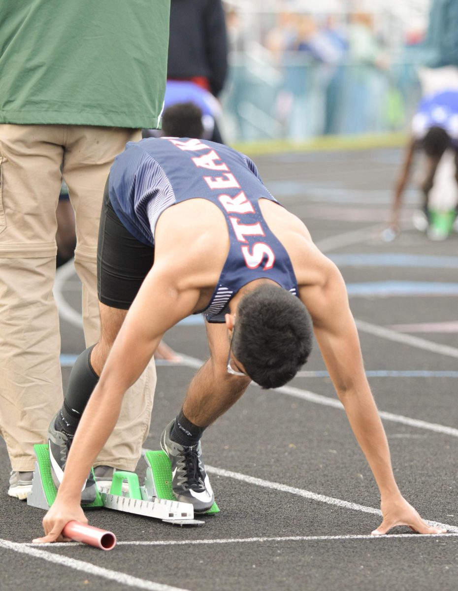 Junior Paulo Gonzalez Saldivar gets ready to begin his race on the blocks. 
