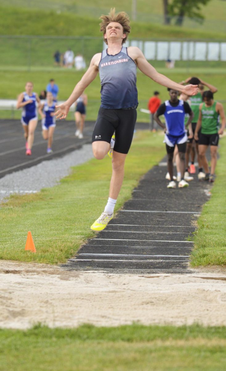 Junior Lucas Swartz completes the long jump. 