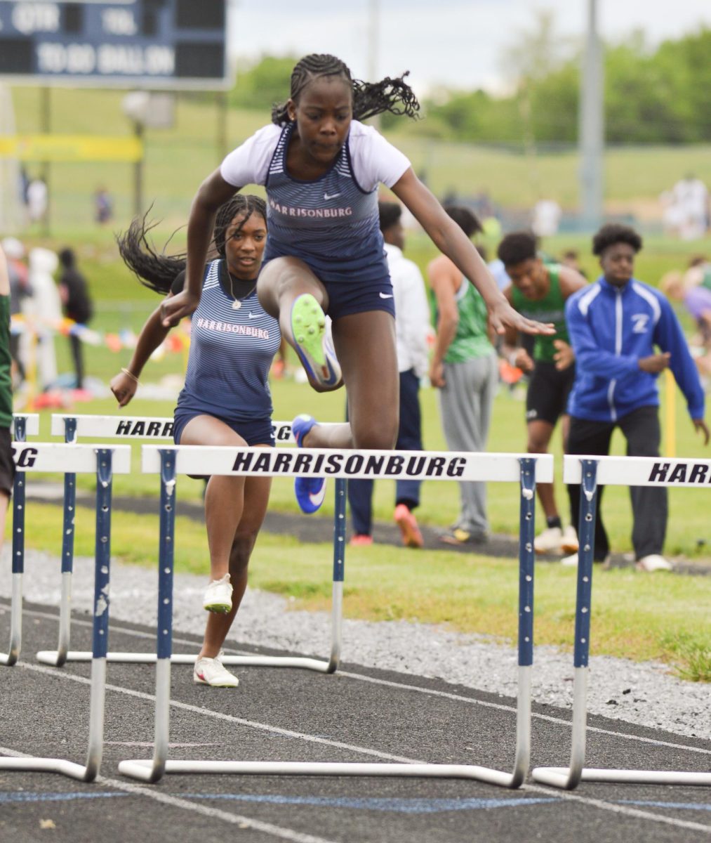 Junior Oreoluwa Akinyemi jumps over the hurdle. 