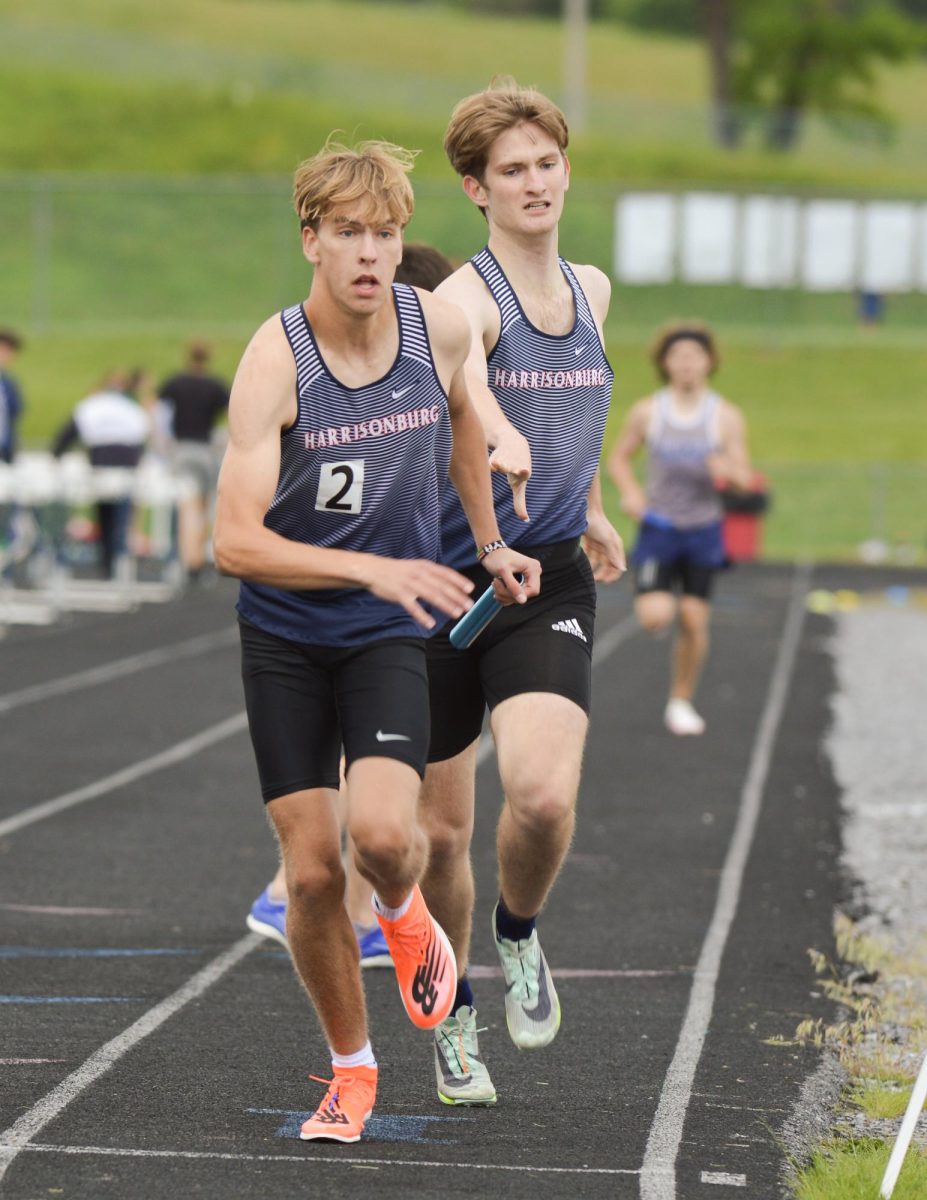 Senior CJ Hulleman passes the baton to senior Andrew McMichael
