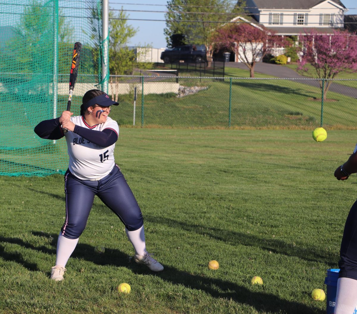 Senior Logaan Whiting warms up to bat Staunton at a home game. 