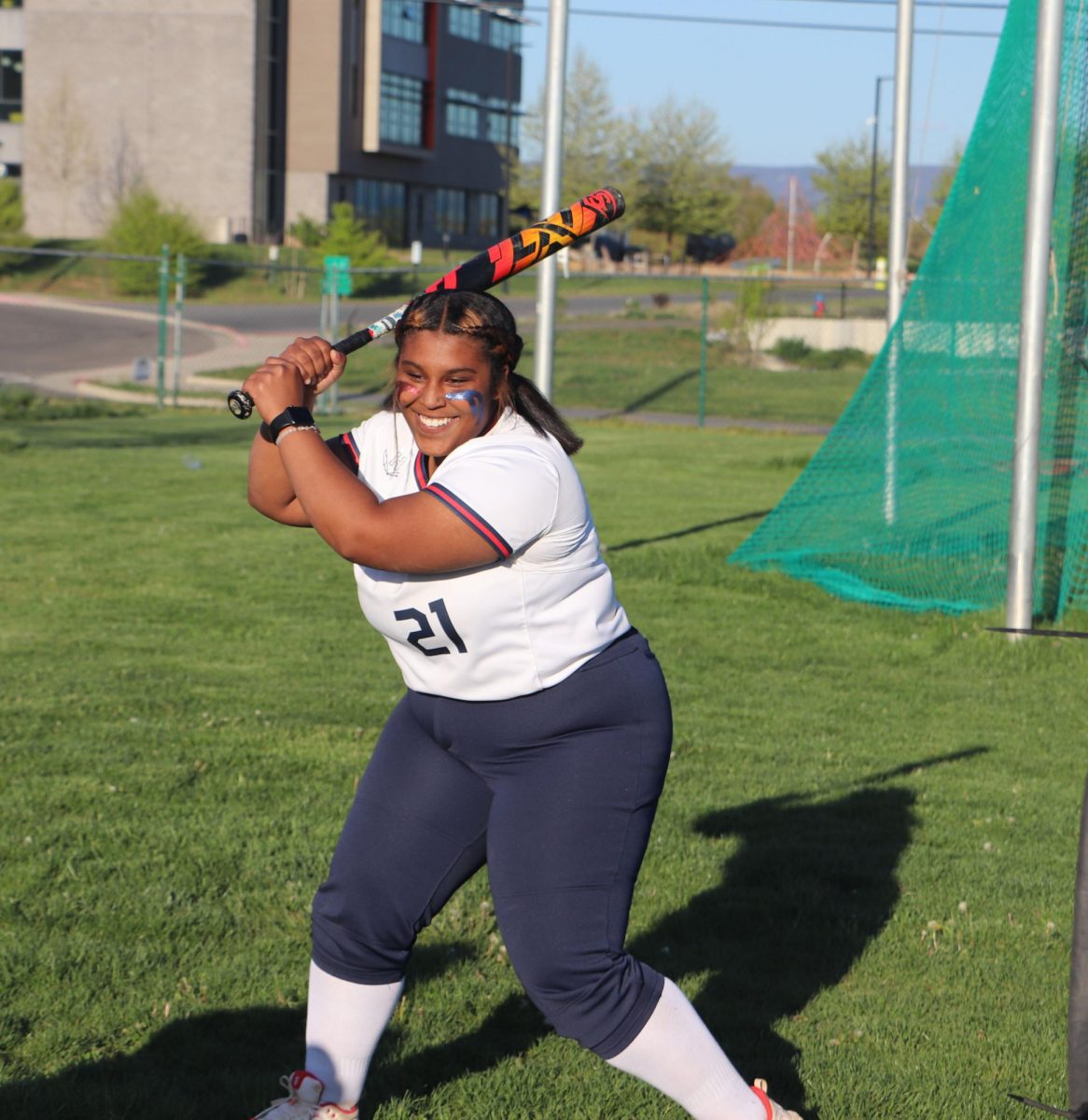 Senior Calliyah Veney warms up to bat against Staunton at home. 