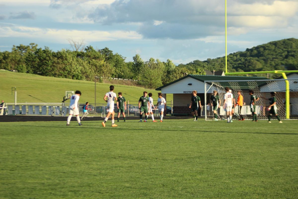 Players getting walking to the keeper box for a corner.