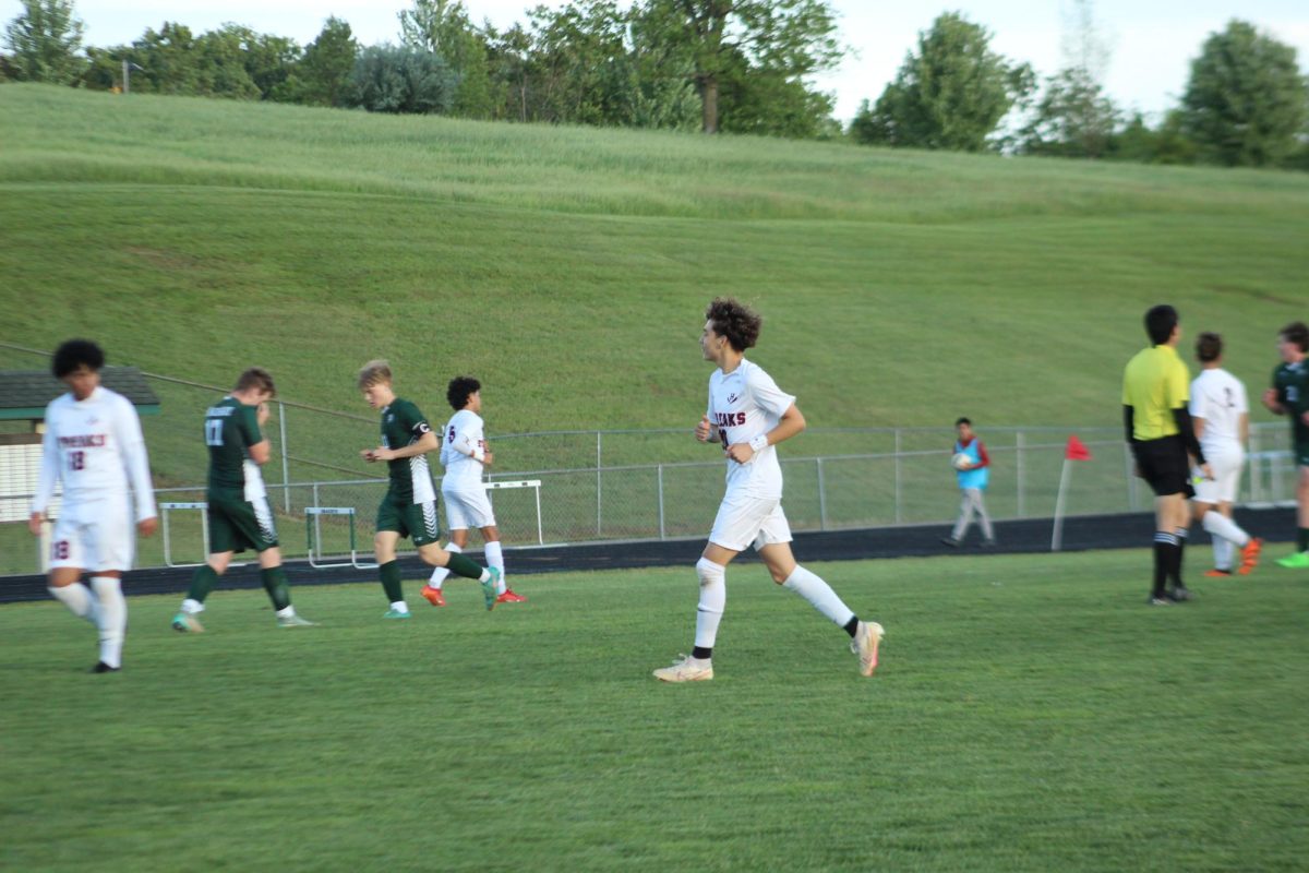 Steve Carranza jogging back to his position after the play.