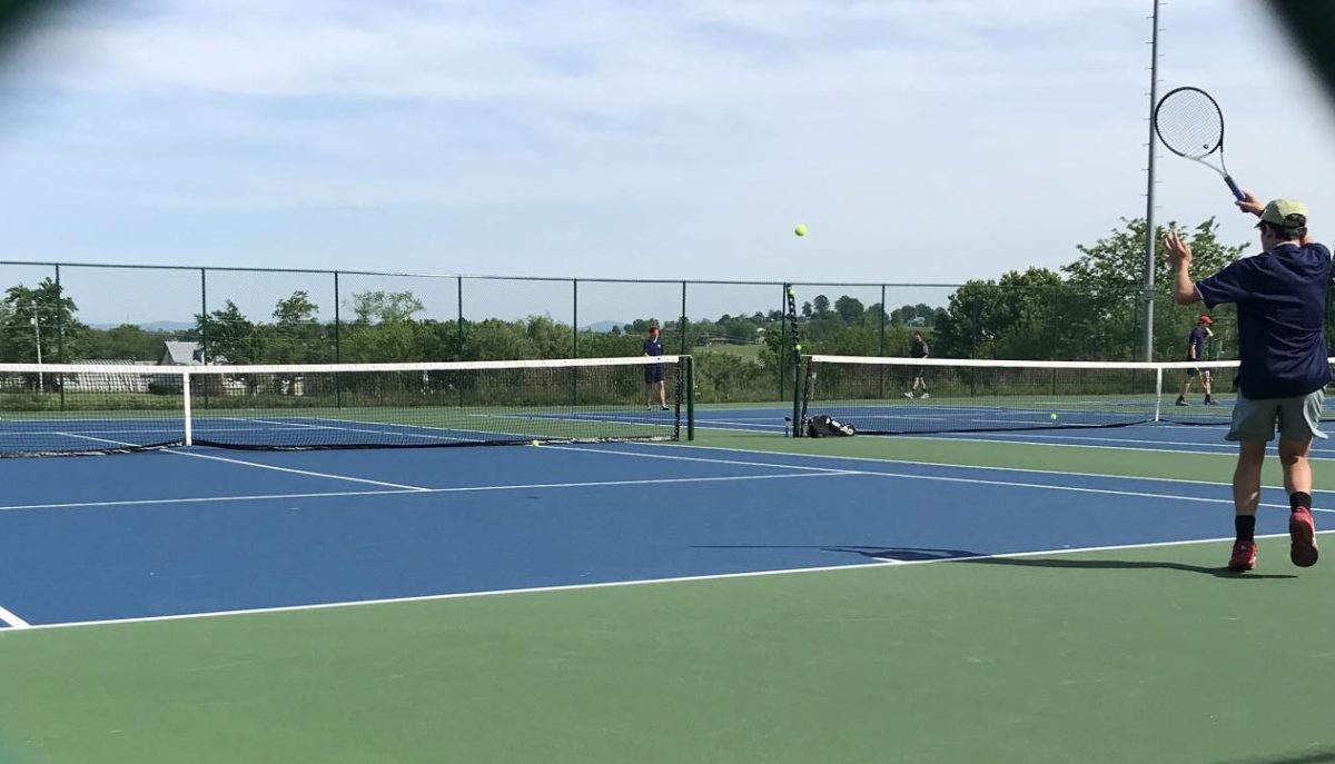 Brody Beshoar hits a forehand against the 2nd seed Massaponax player.