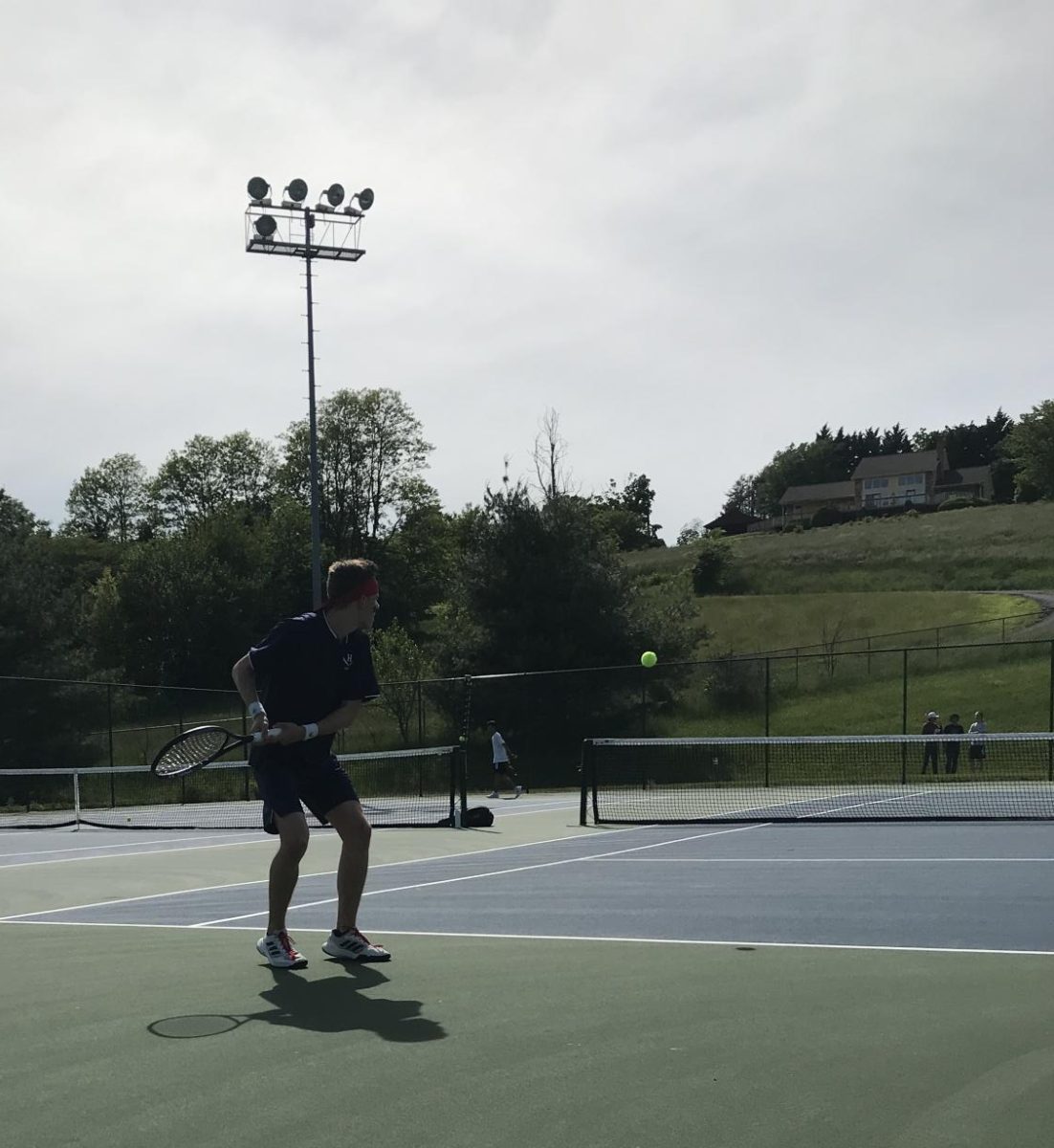 Louis Gibson hits a backhand against the Massaponax 3rd seed player.