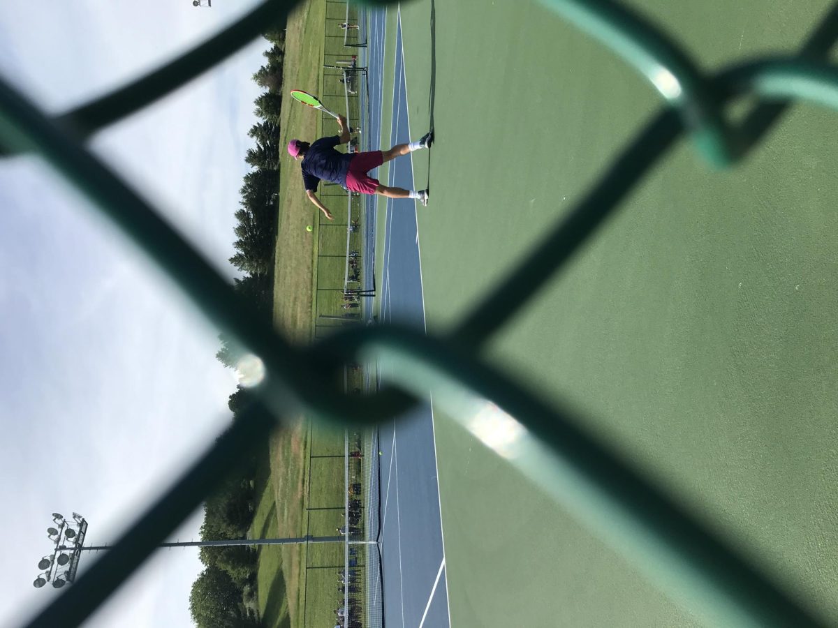 Julien Steines hits a forehand against the Massaponax 1st seed player.