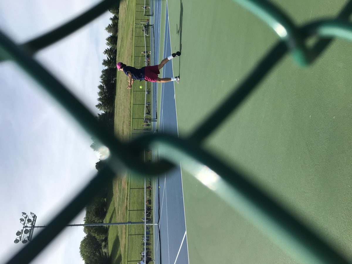 Julien Steines hits a forehand against the Massaponax 1st seed player.