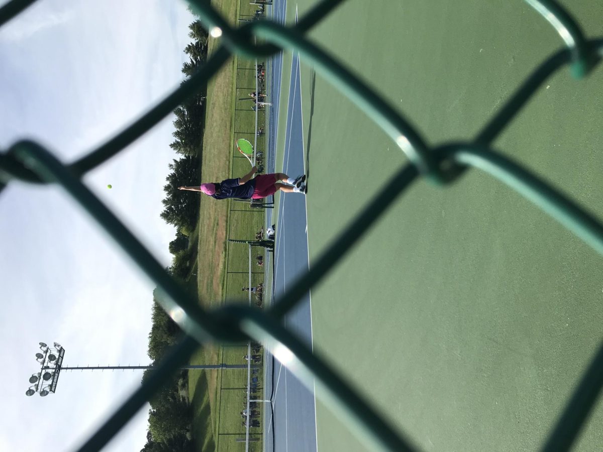 Julien Steines serves against the Massaponax 1st seed player.