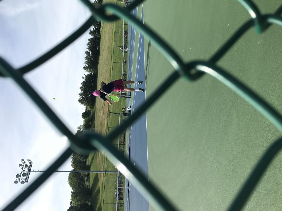 Julien Steines serves against the Massaponax 1st seed player.