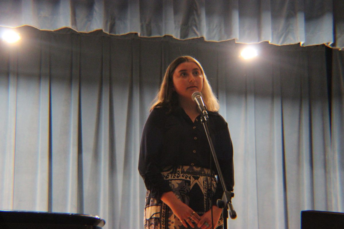 Sophomore Abby Bloss sings a solo to "Fight For Me."