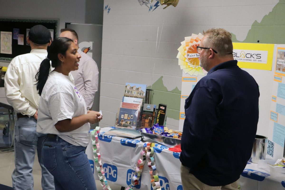 Blacks Flooring had a booth where students could name colors and the best name would win two gallons of paint. 