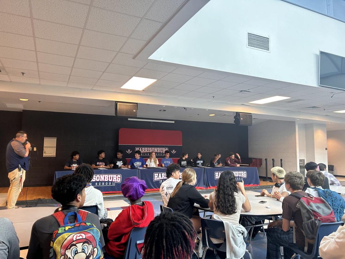 Athletes line up to sign their agreements to further their athletic career on Signing day Friday May 17.