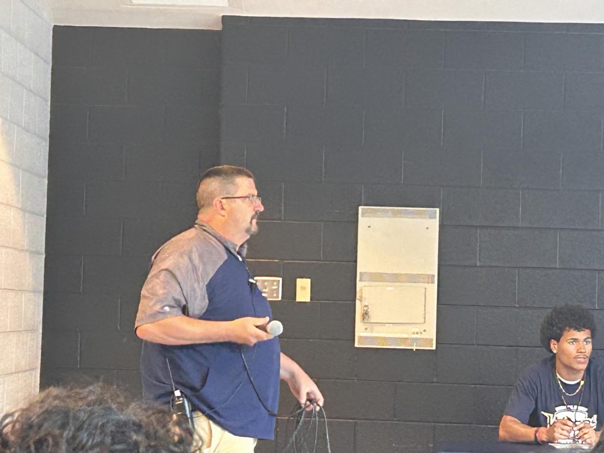 Athletic Director Brandon Burley prepares to Announce the senior Athletes. 