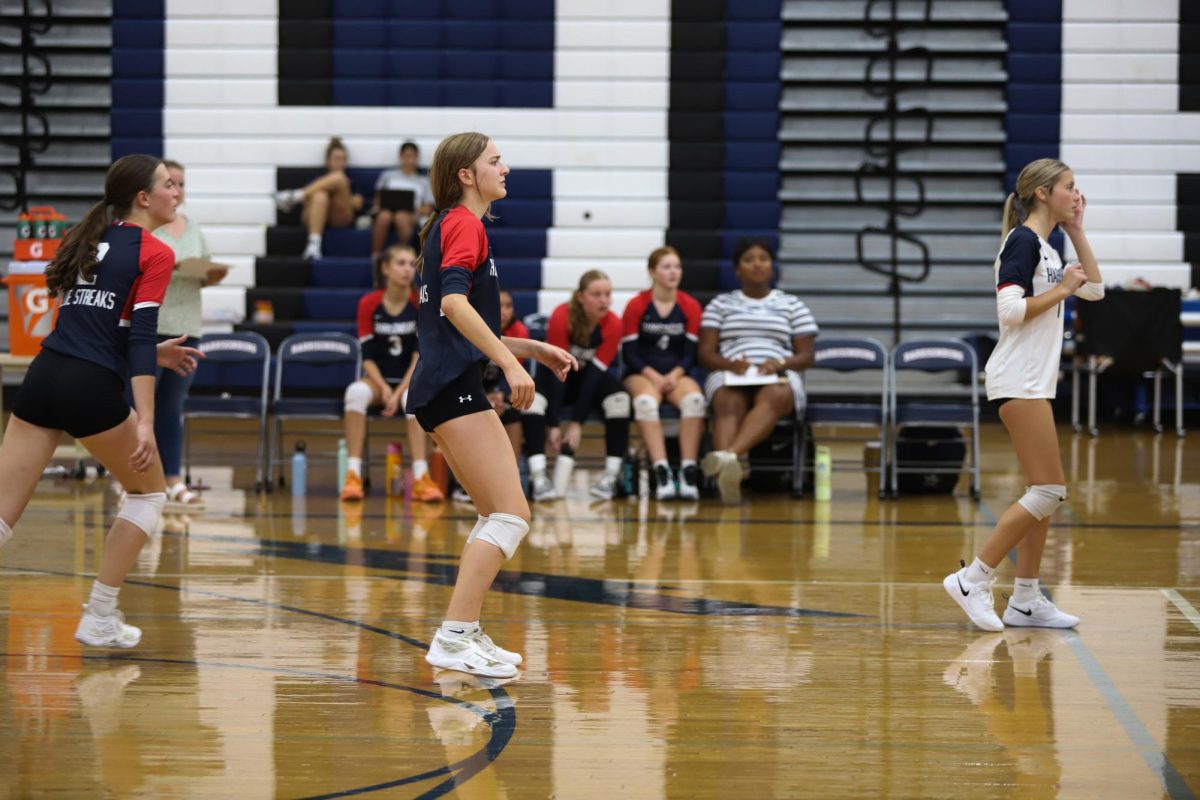 Freshman Maren Bert prepares to receive ball.