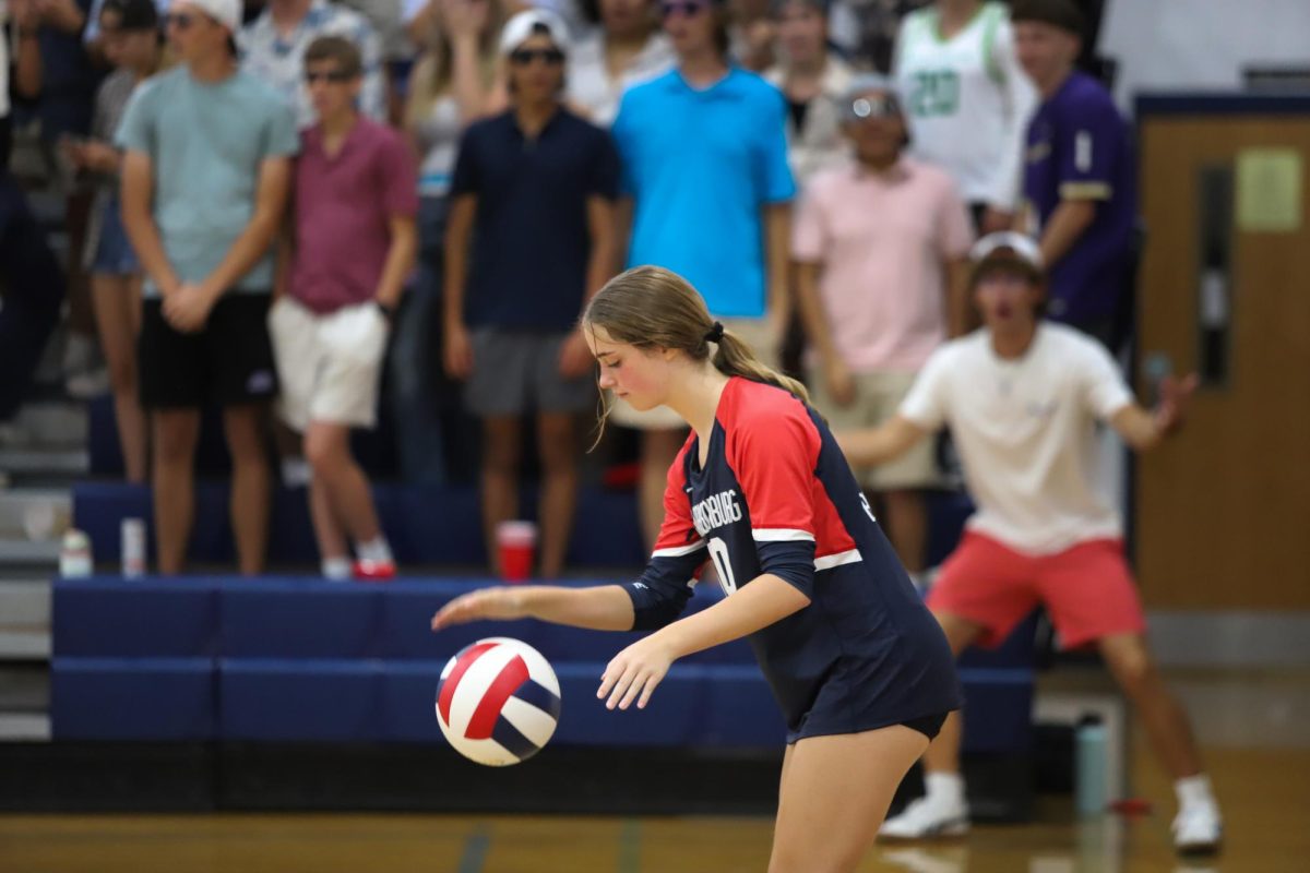 Senior Macy Waid bounces the ball before serve.